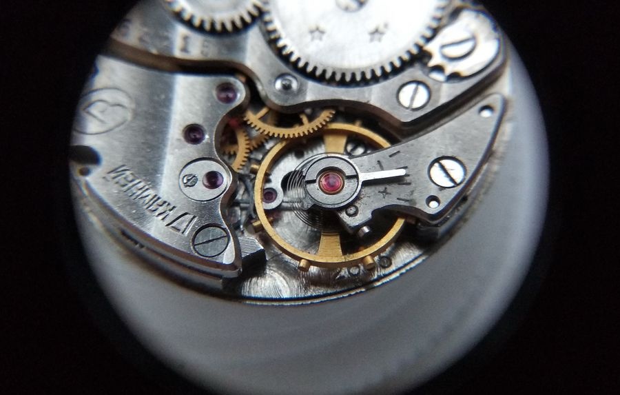 Vostok 2605 balance cock cap jewel after cleaning with MBP-12 lubrication drop clearly visible before reinstallation