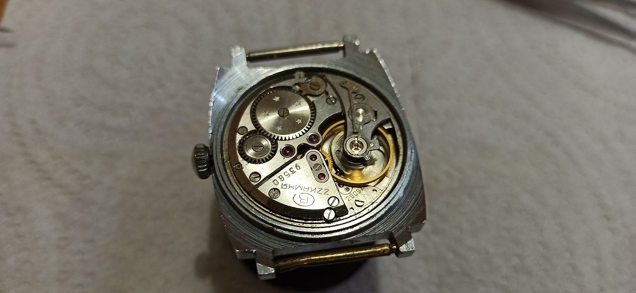 The 2809 movement trial-fitted into a Pobeda case showing a loose fit