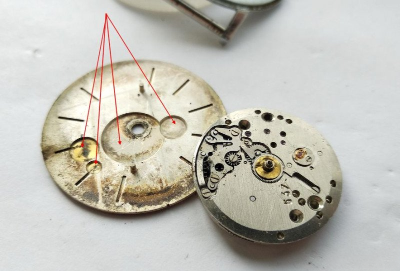 Dial back showing four recesses for wheel clearance