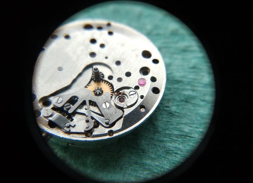 The cap jewel of the bushing being lubricated with a measured droplet of oil