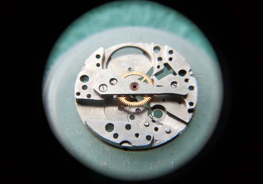 The cleaned barrel with the mainspring being lubricated with precision-mechanism oil
