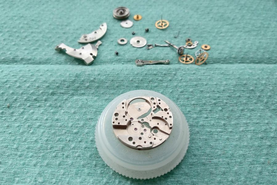 The bare cleaned main plate mounted on a movement holder ready for reassembly