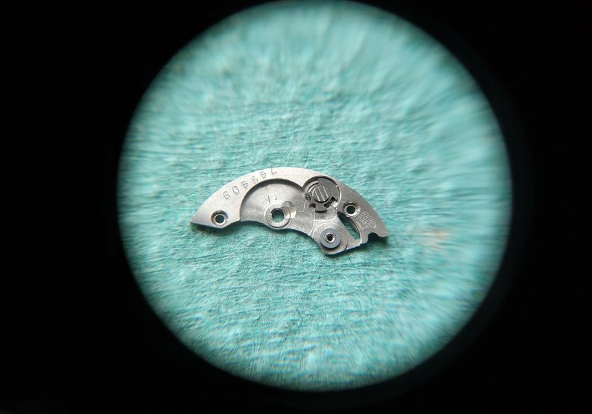 The stem-release button being installed before the barrel bridge is fitted