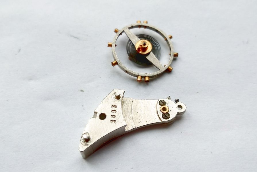 Balance components separated on the bench during servicing