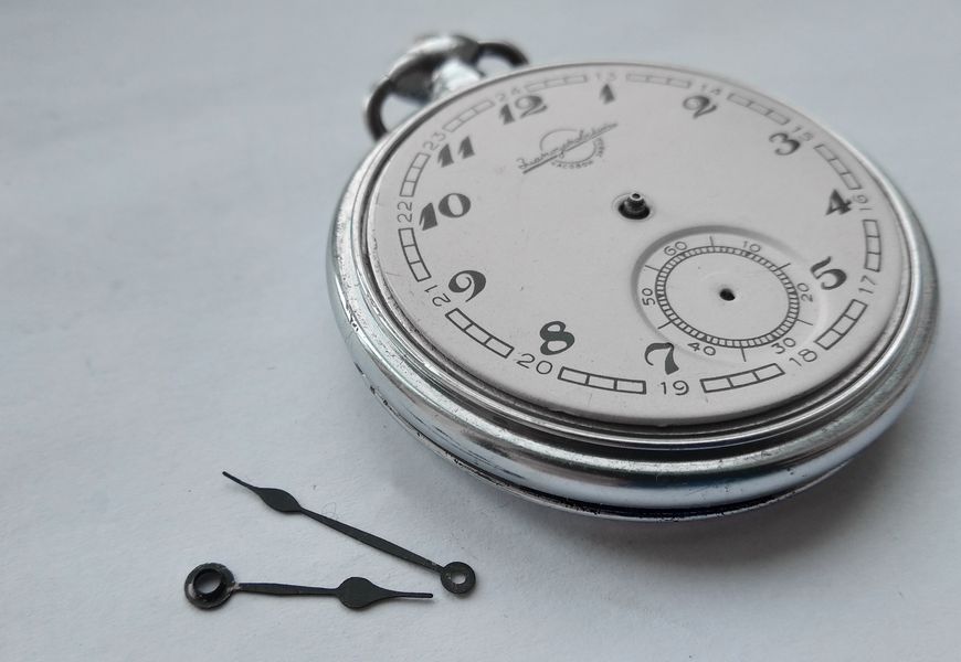 The two case-retaining screws that hold the movement in the case