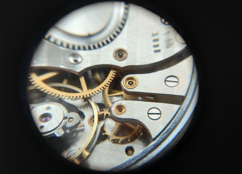 The setting-lever screw that must be loosened to release the winding stem