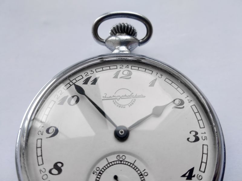 Open caseback revealing the K-43 movement with gilded chaton jewels and engraved barrel-bridge markings