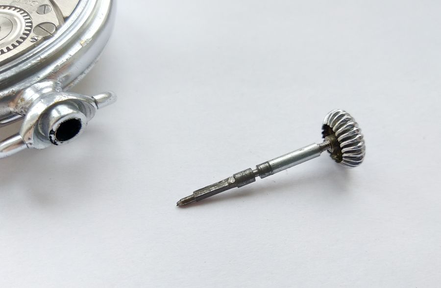Bezel and domed crystal levered off the snap-fit case at the filed flat