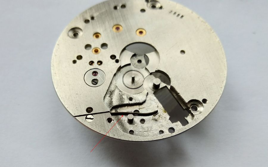 Main plate stripped of keyless parts, the captive setting-lever spring left in place, ready for cleaning