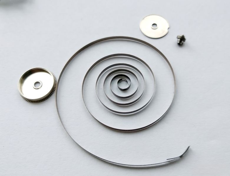 Wiping mainspring with oiled cloth