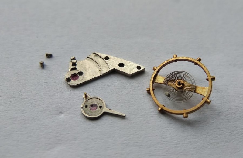 Lubricating balance cap jewel with MBP-12