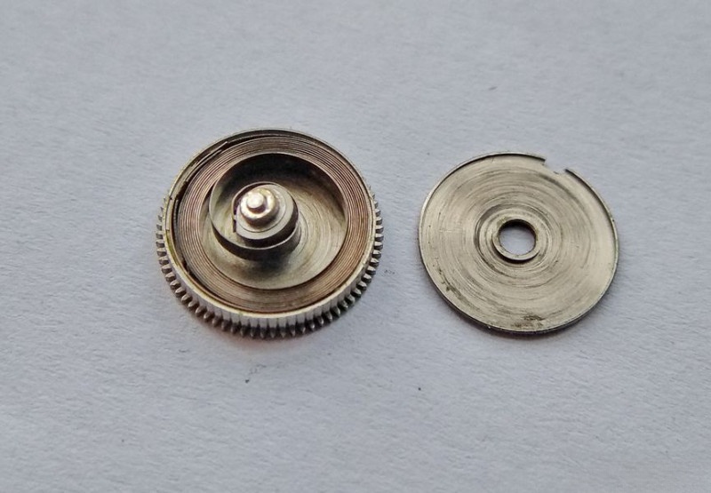 Opening barrel to access mainspring
