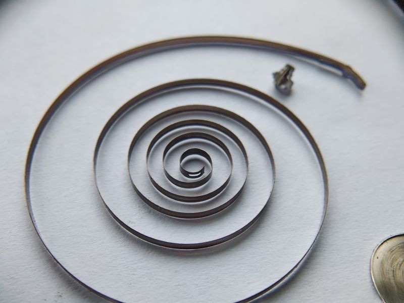 Inner mainspring turn showing arbor attachment